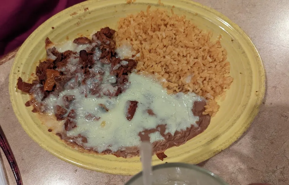 One Beef Taco Rice & Refried Beans